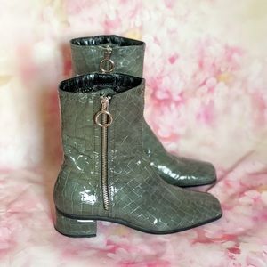 Green patent boots with black sole